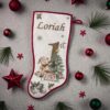personalised-babys-first-christmas-stocking-red-edging-fireplace-display