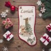 personalised-babys-first-christmas-stocking-red-edging-fireplace-display-wooden
